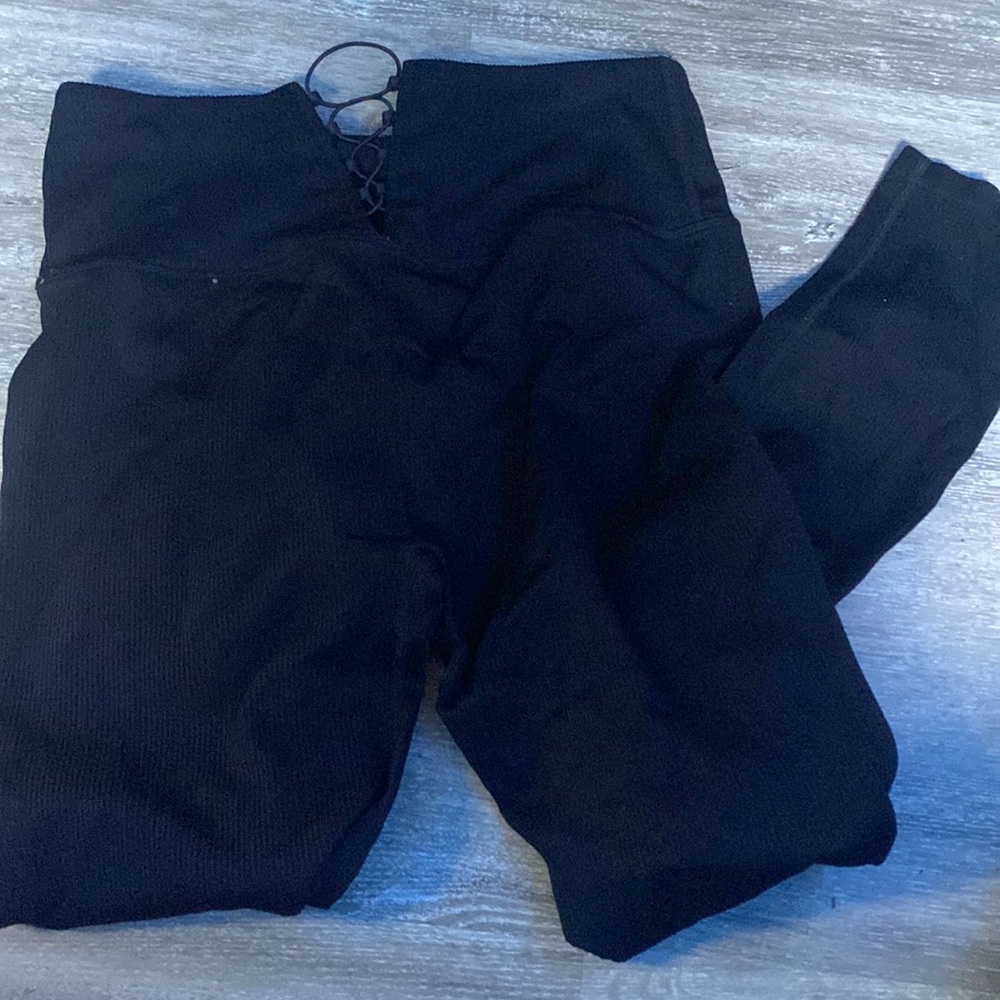 These are black open back leggings.